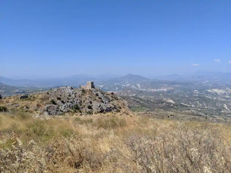 Acrocorinth summit with a Frankish tower seen from afar